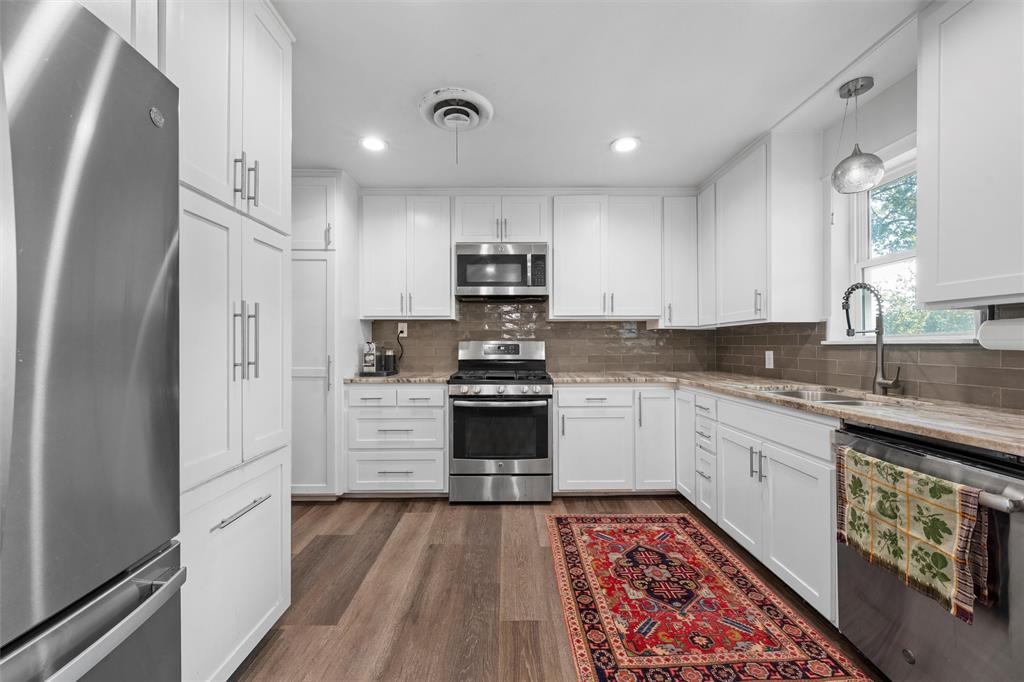 6224 Summit Ridge Drive Waco, TX 76710 - Photo 9 of 25 a kitchen with cabinets appliances and a counter space