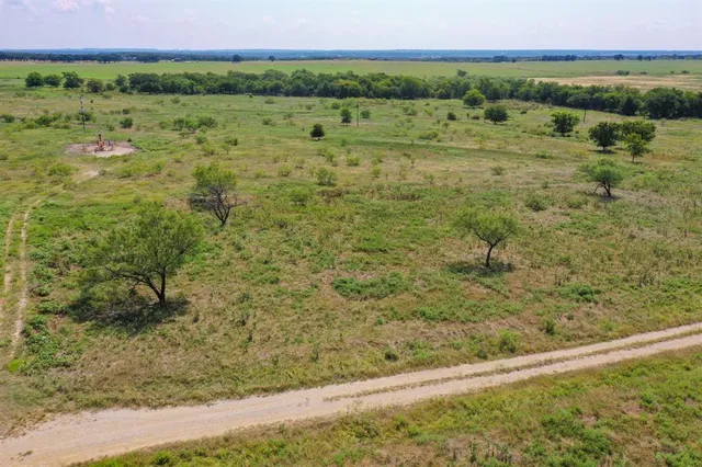 a view of a field with an outdoor space