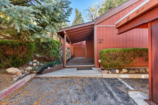 a view of a backyard with plants and a garden