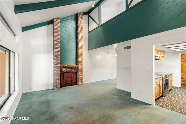 a view of a hallway with wooden shelves