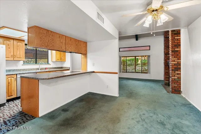 an empty room with windows and entrance