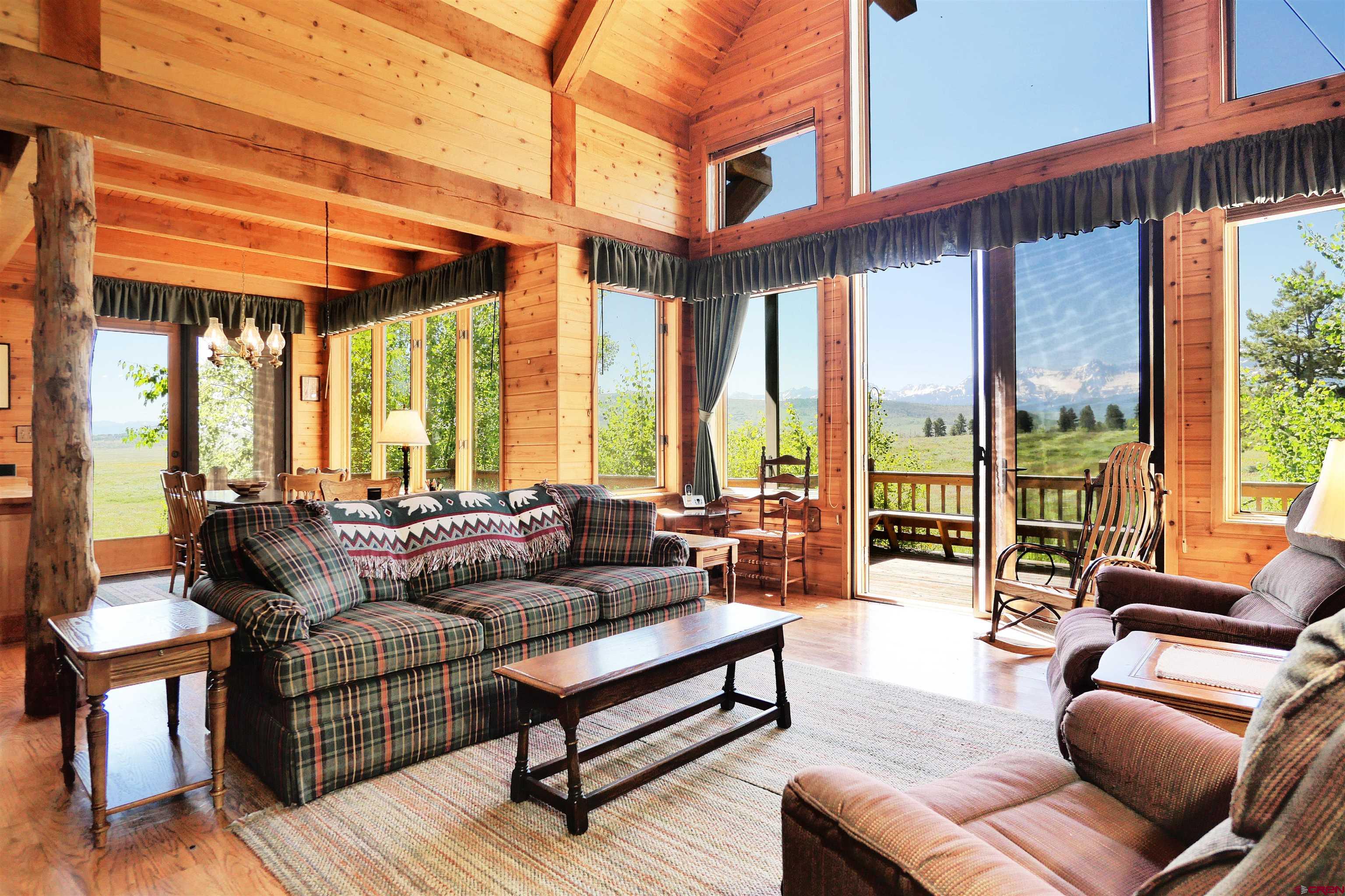 2425 62x Road Placerville, CO 81430 - Photo 12 of 30 a living room with furniture city view and large windows
