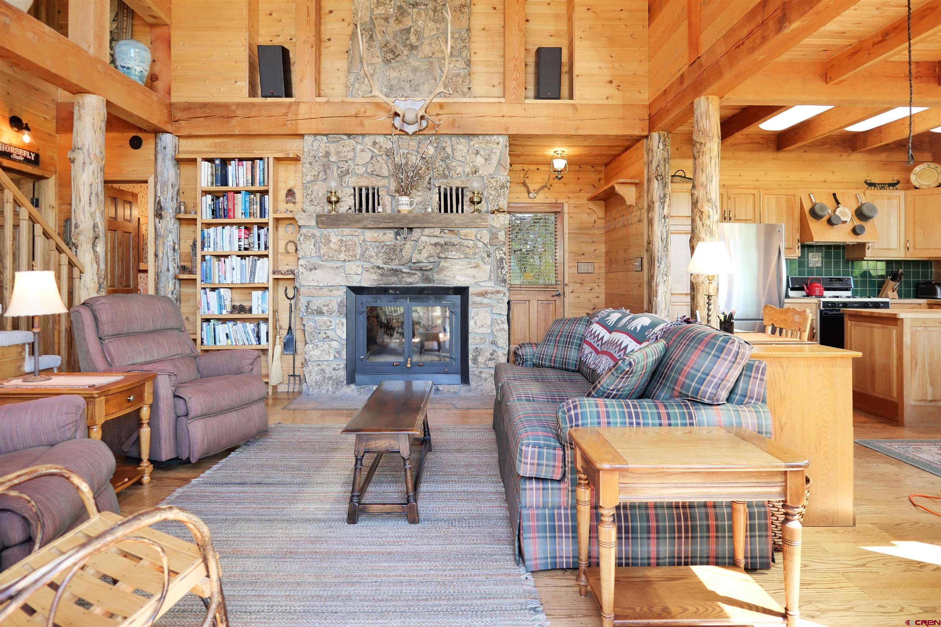2425 62x Road Placerville, CO 81430 - Photo 19 of 30 a living room with furniture or fireplace and a wooden floor