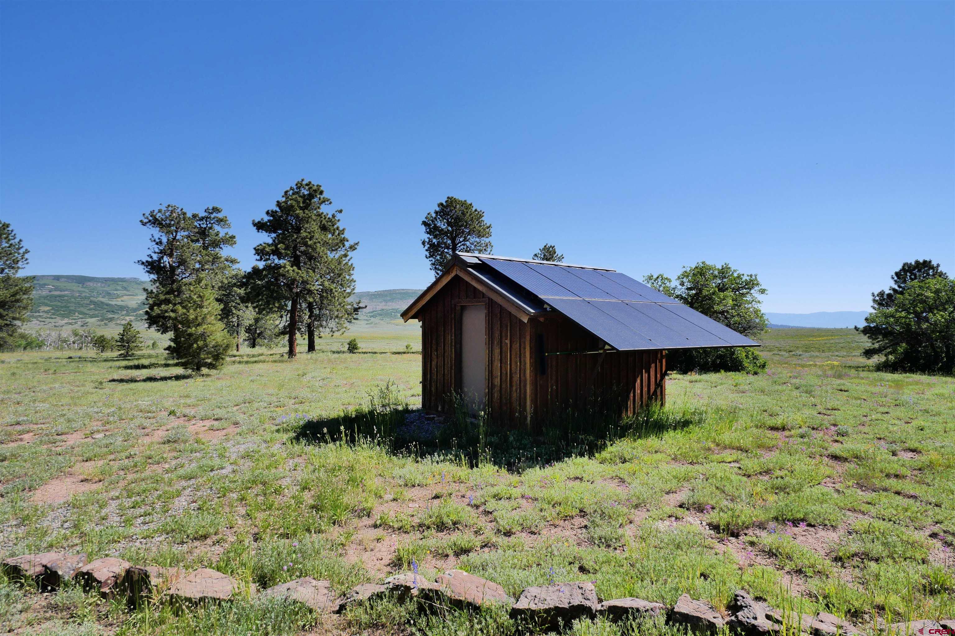 2425 62x Road Placerville, CO 81430 - Photo 25 of 30 a view of a house with a yard