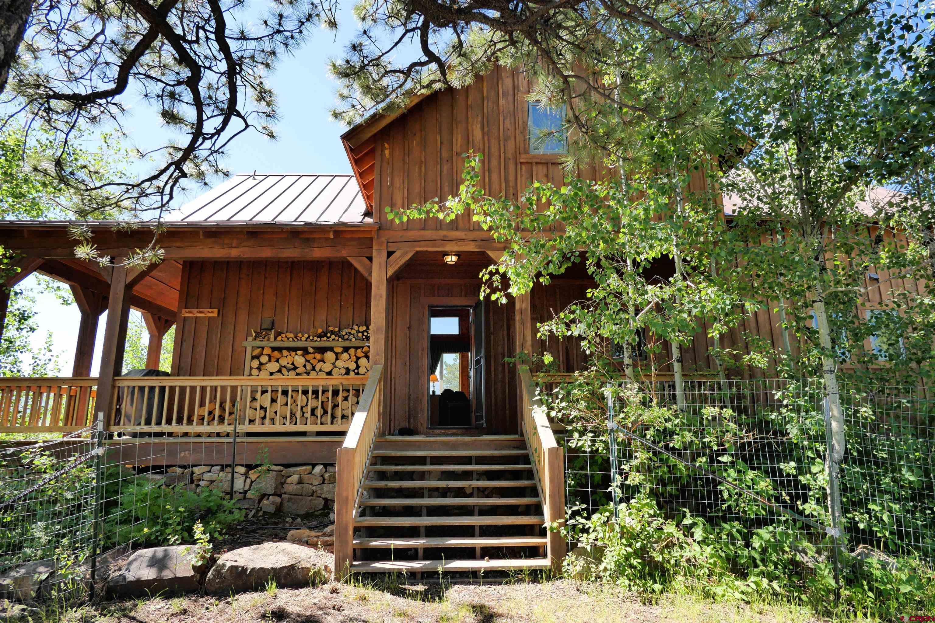 2425 62x Road Placerville, CO 81430 - Photo 8 of 30 a view of a house with fountain and porch