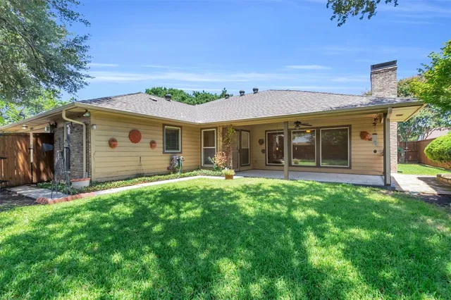 front view of a house with a big yard