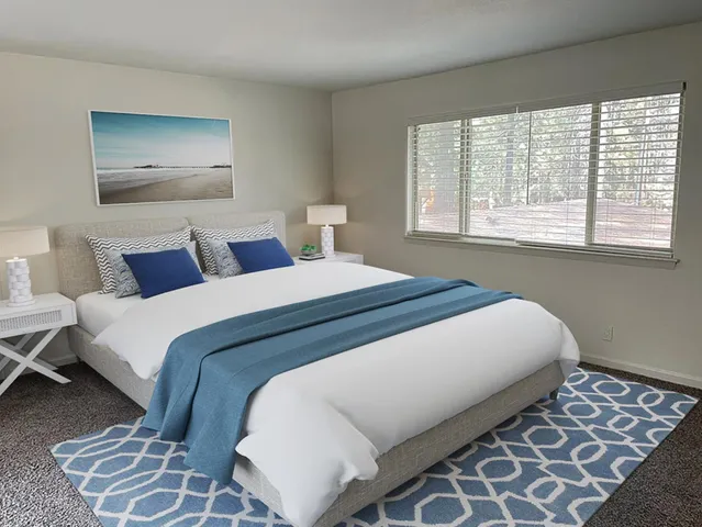 a view of a lake with lawn chairs