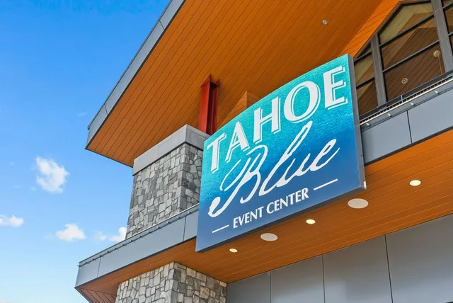 a view of swimming pool with outdoor space and trees all around