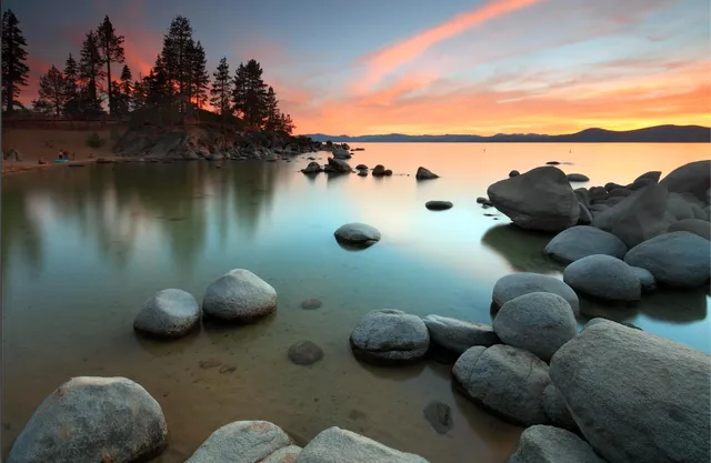 a view of house with backyard and trees around