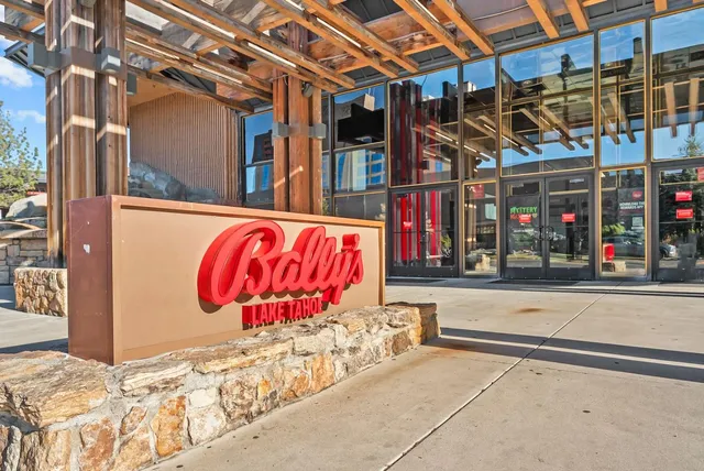a view of a patio with table and chairs and potted plants