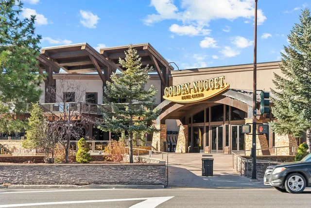 a view of outdoor area with window and retail shops