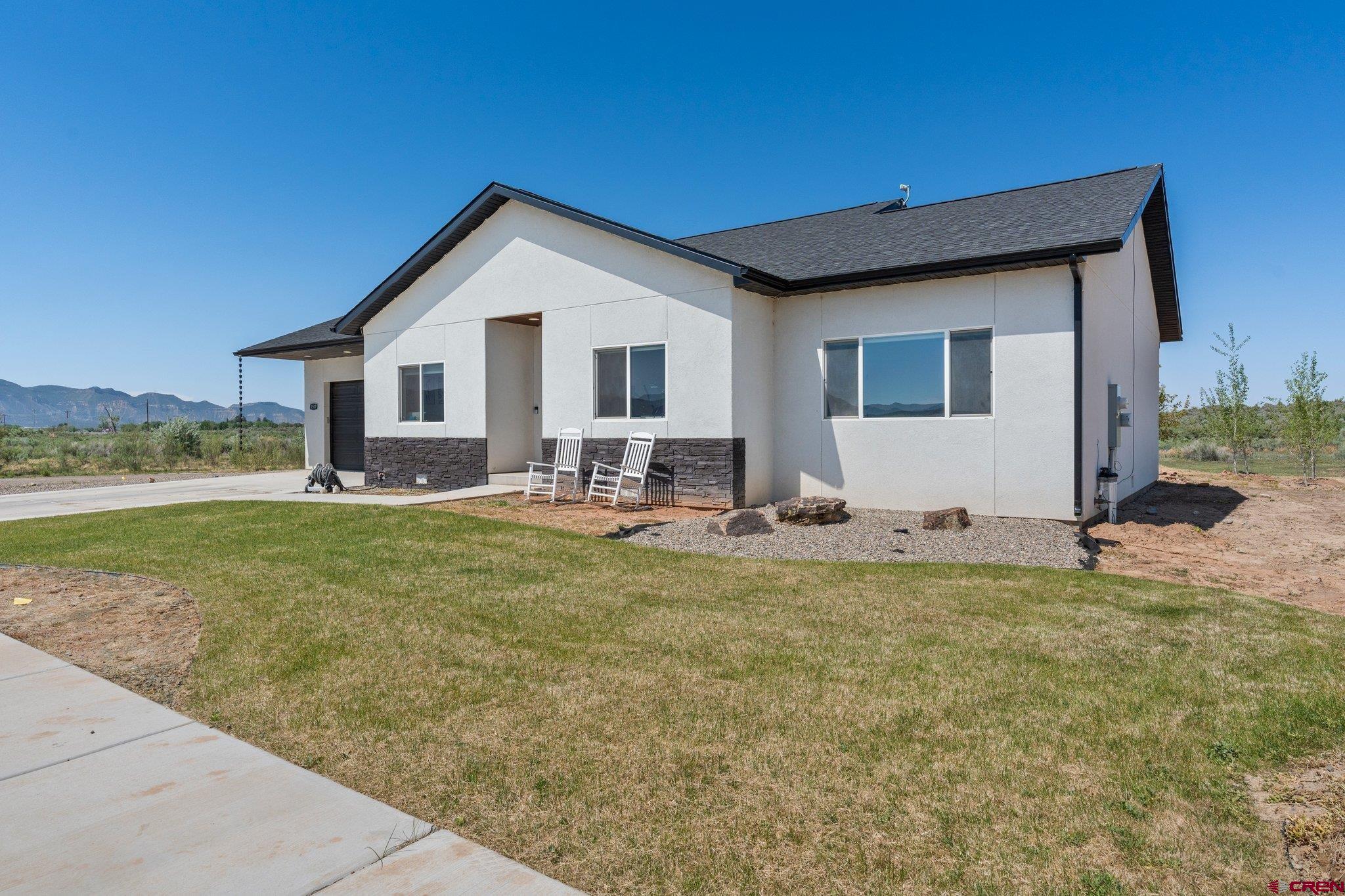 1517 Golf Course Lane Cortez, CO 81321 - Photo 1 of 41 a front view of house with yard and seating space