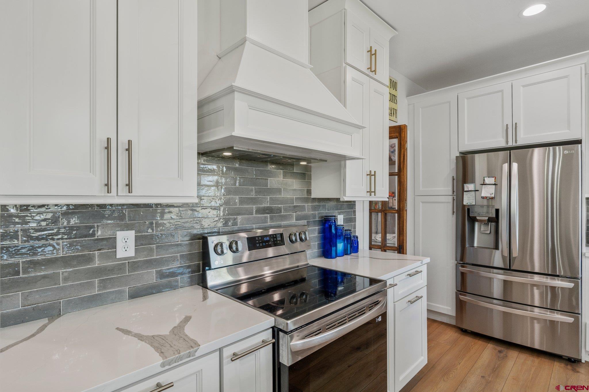 1517 Golf Course Lane Cortez, CO 81321 - Photo 11 of 41 a kitchen with appliances a sink and cabinets