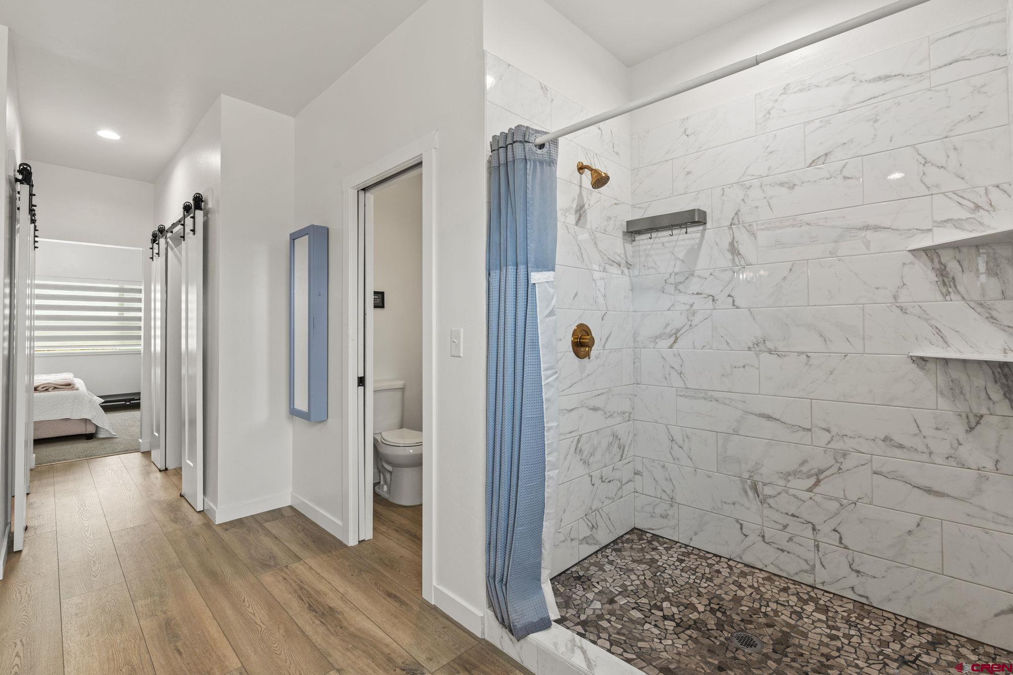 1517 Golf Course Lane Cortez, CO 81321 - Photo 18 of 41 a bathroom with a shower