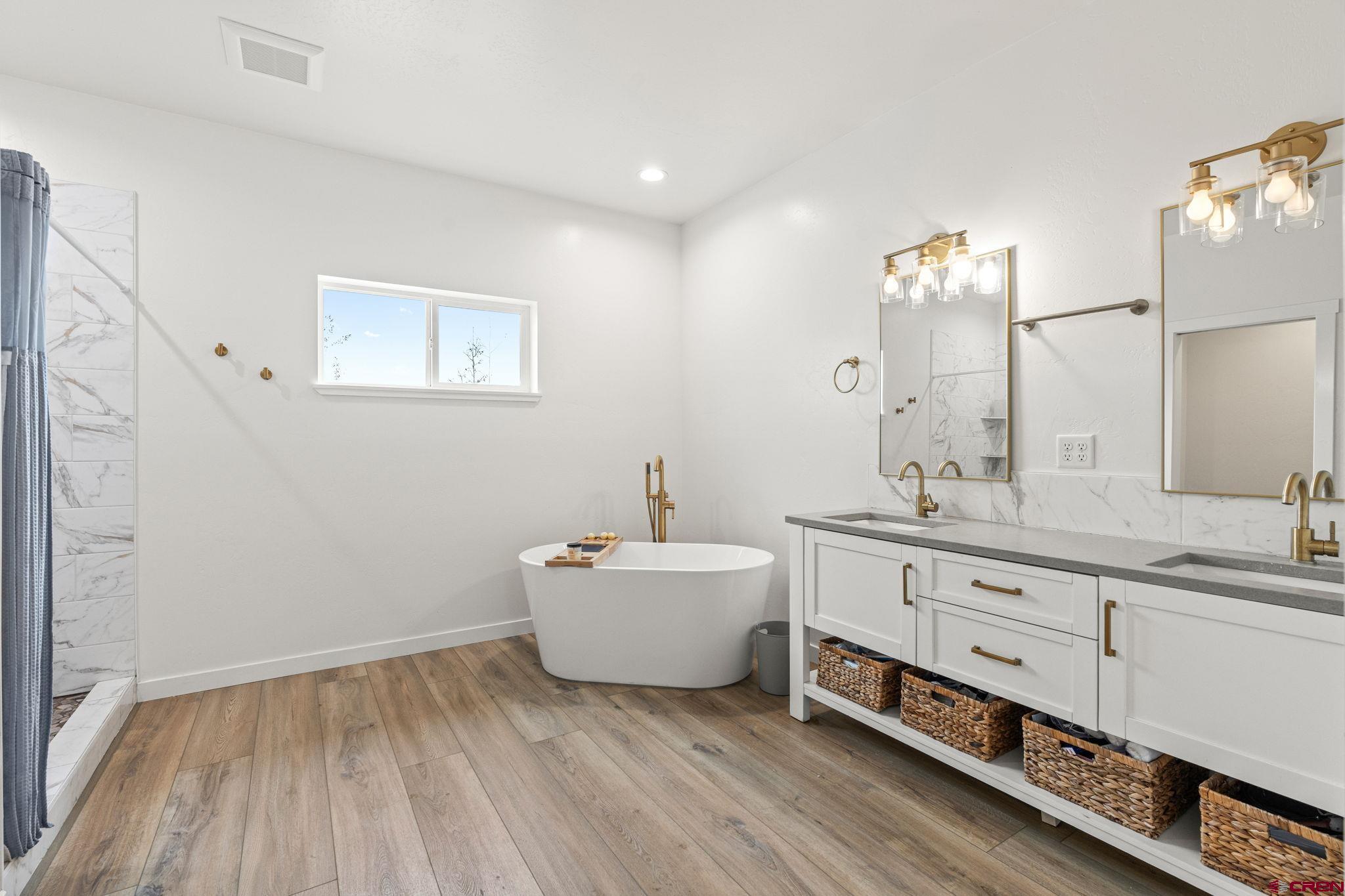 1517 Golf Course Lane Cortez, CO 81321 - Photo 19 of 41 a bathroom with a sink and a mirror