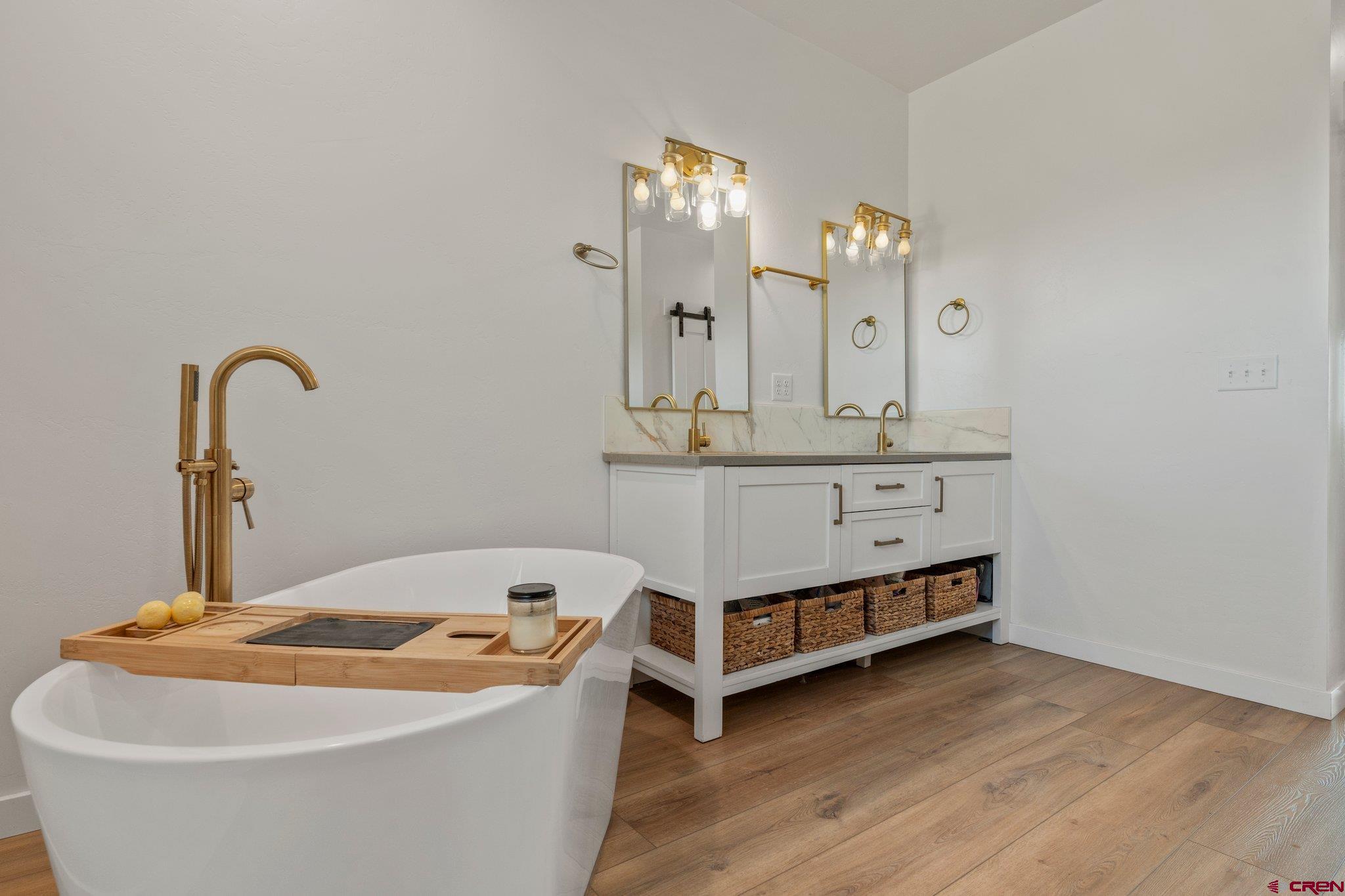 1517 Golf Course Lane Cortez, CO 81321 - Photo 21 of 41 a room with a table chairs and wooden floor