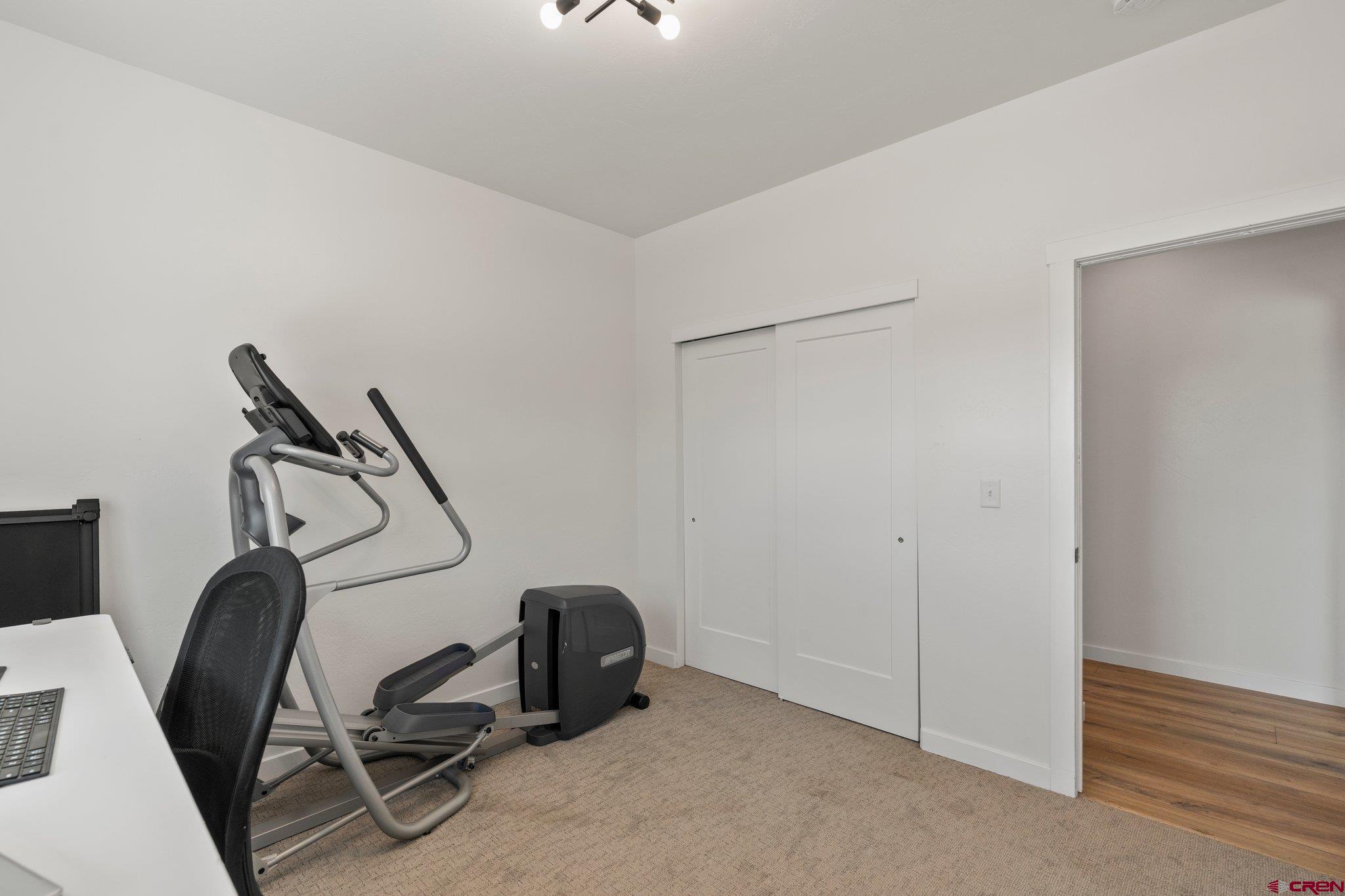 1517 Golf Course Lane Cortez, CO 81321 - Photo 23 of 41 a view of a room with gym equipment
