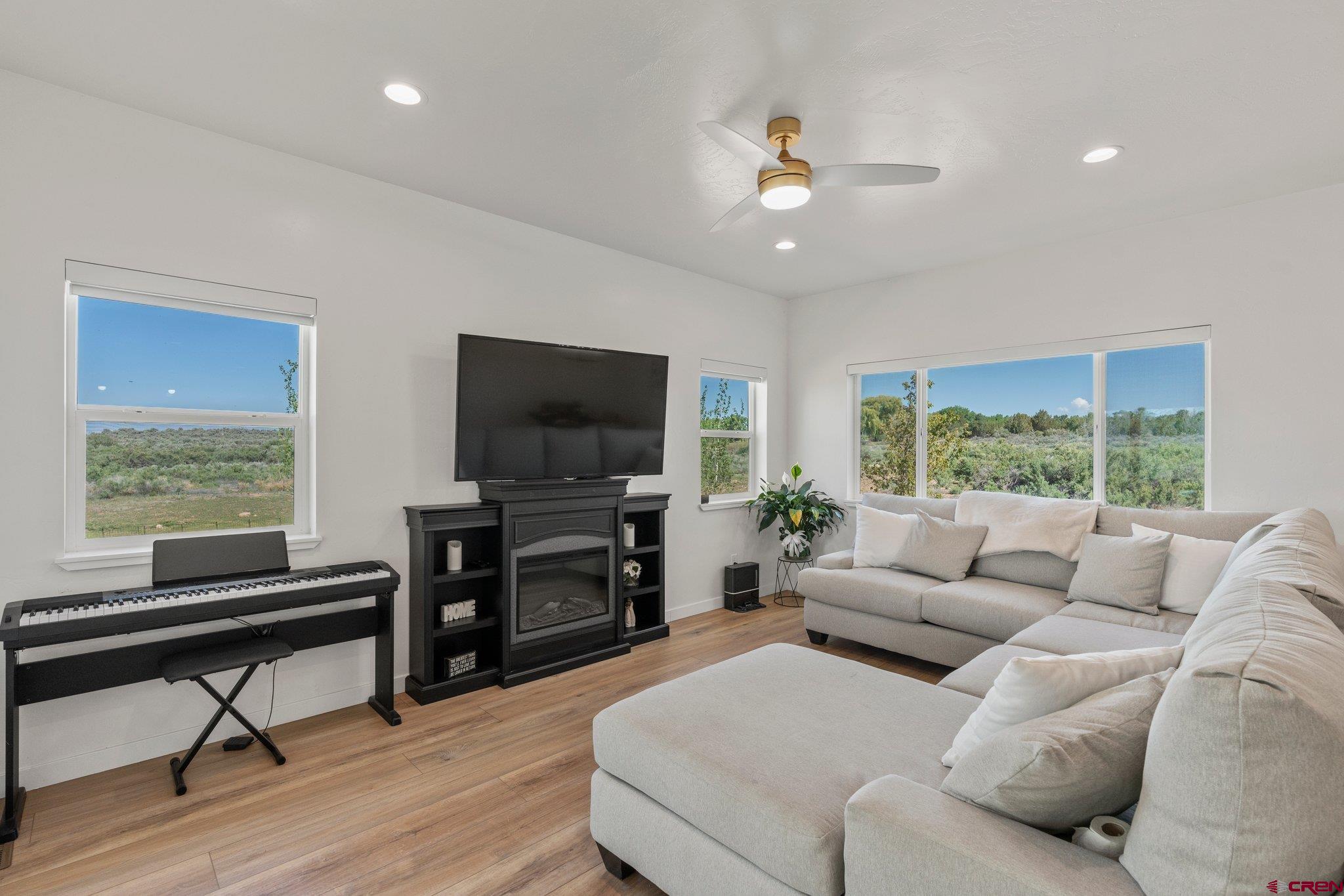 1517 Golf Course Lane Cortez, CO 81321 - Photo 3 of 41 a living room with furniture and a flat screen tv