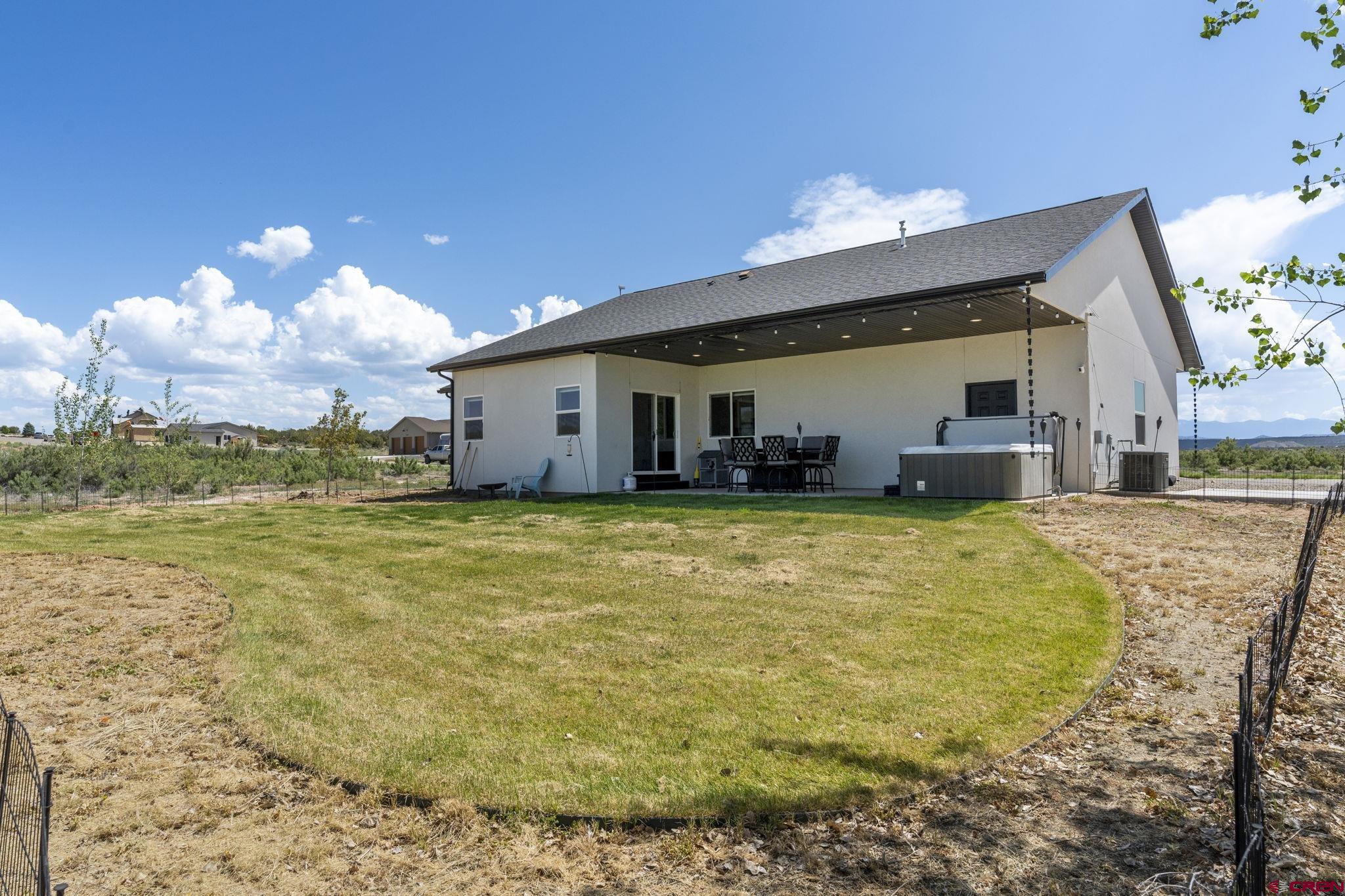 1517 Golf Course Lane Cortez, CO 81321 - Photo 37 of 41 a view of a house with a swimming pool