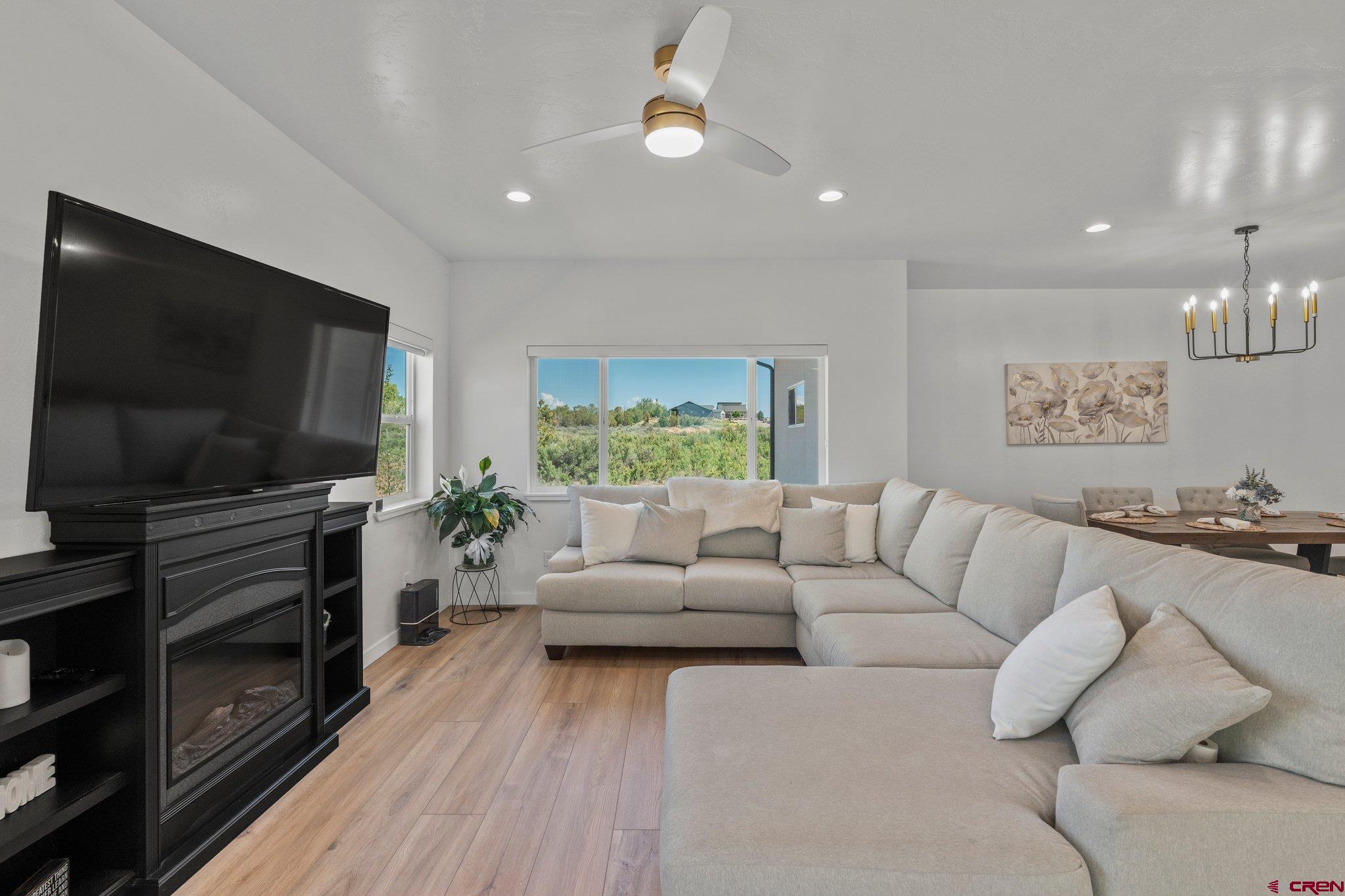 1517 Golf Course Lane Cortez, CO 81321 - Photo 4 of 41 a living room with furniture and a flat screen tv