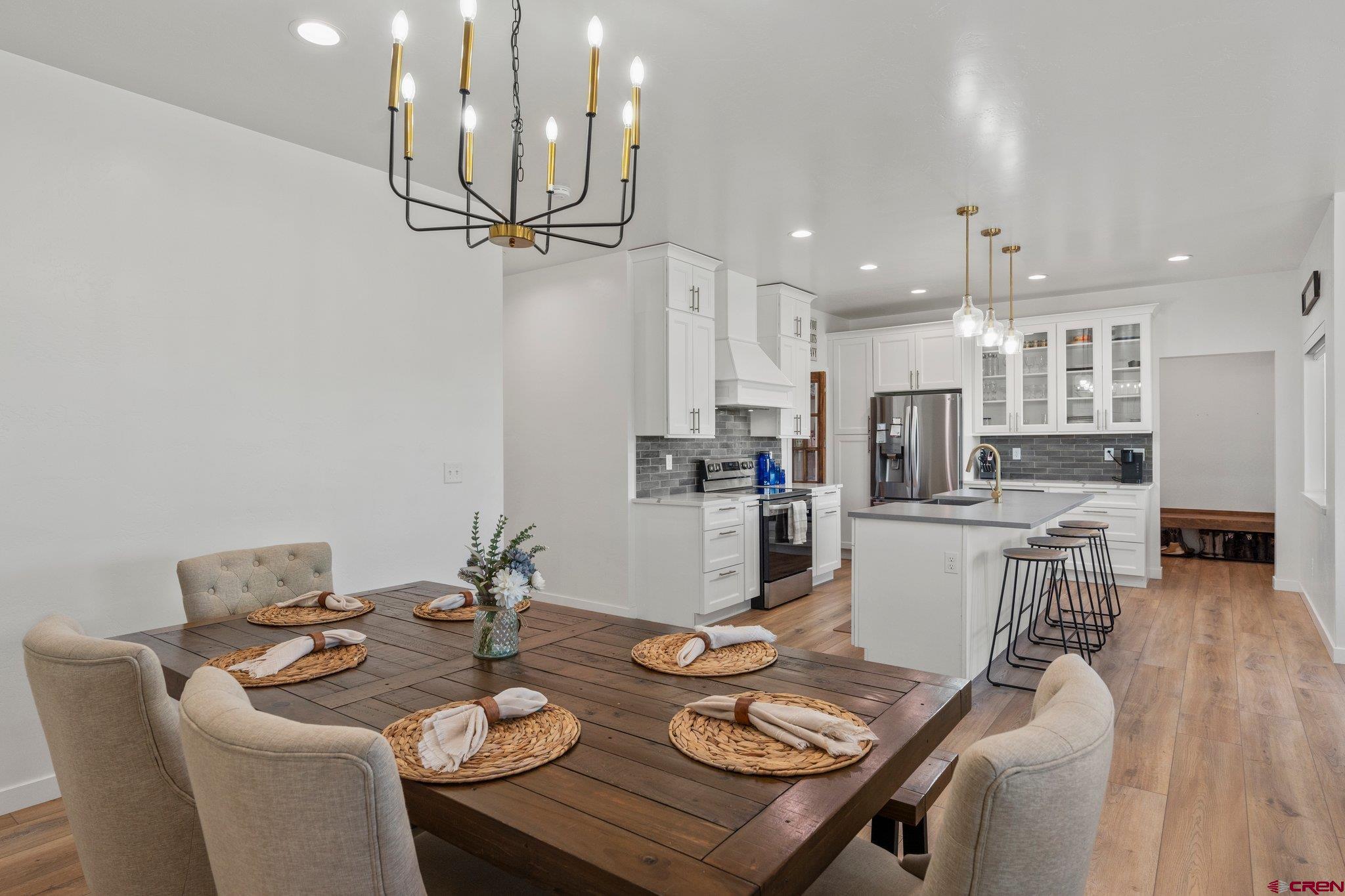 1517 Golf Course Lane Cortez, CO 81321 - Photo 7 of 41 a open dining room with furniture and a kitchen view