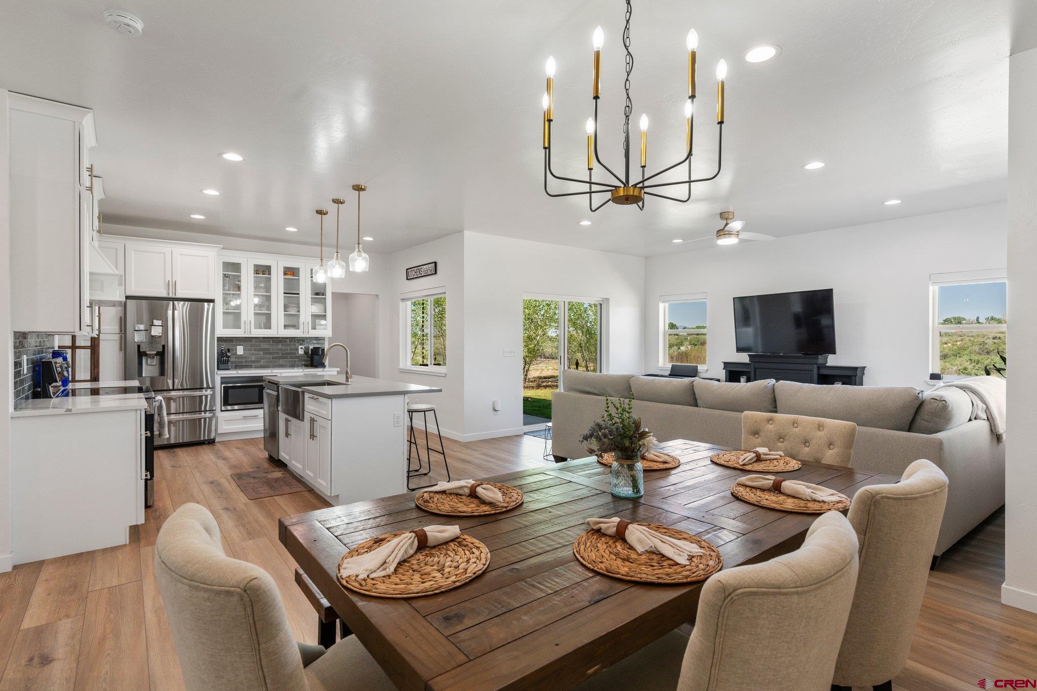 1517 Golf Course Lane Cortez, CO 81321 - Photo 8 of 41 a living room with furniture kitchen and a chandelier