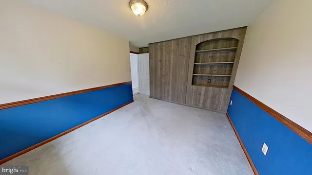 a view of wooden floor and windows in a room