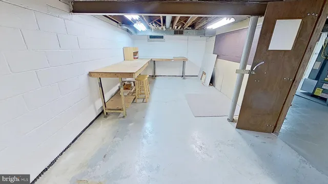 a view of a storage & utility room with stairs