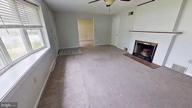 wooden floor and fireplace in livingroom with a fireplace
