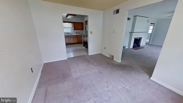 a view of a livingroom and a kitchen
