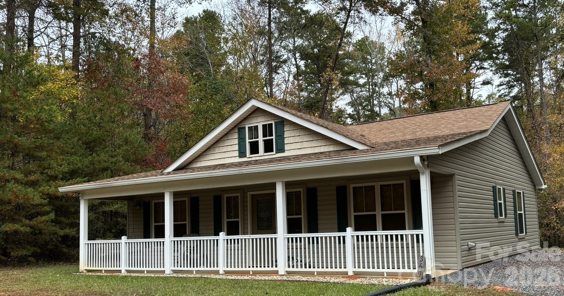 369 Pinecrest Circle Troy, NC 27371 - Photo 2 of 19 a house with trees in the background