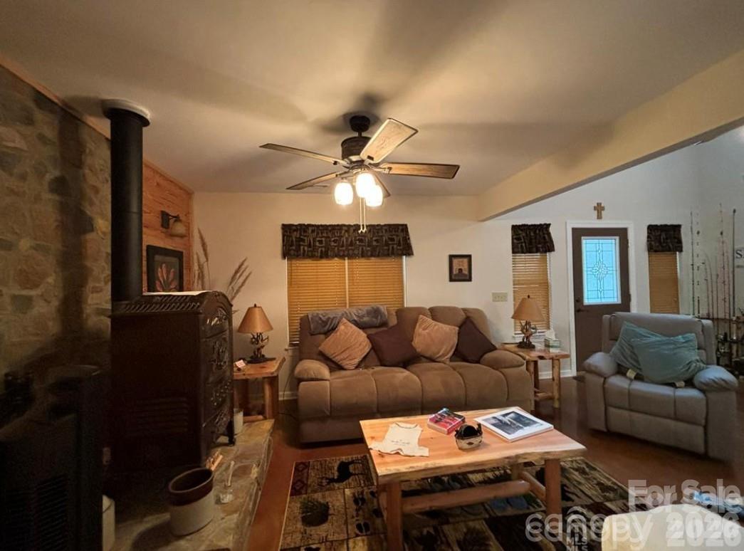369 Pinecrest Circle Troy, NC 27371 - Photo 4 of 19 a living room with furniture and a flat screen tv