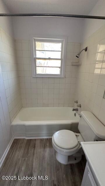 5110 46th Street Lubbock, TX 79414 - Photo 14 of 17 a bathroom with a toilet and a bath tub