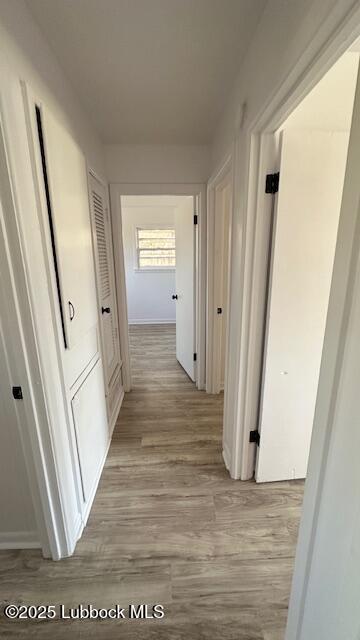 5110 46th Street Lubbock, TX 79414 - Photo 16 of 17 a view of a hallway with wooden floor and staircase