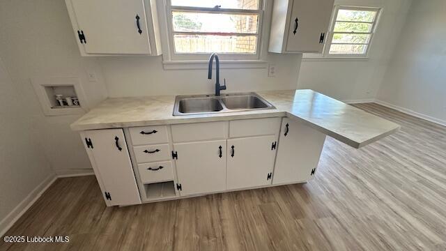 5110 46th Street Lubbock, TX 79414 - Photo 5 of 17 a kitchen with cabinets a window and stainless steel appliances