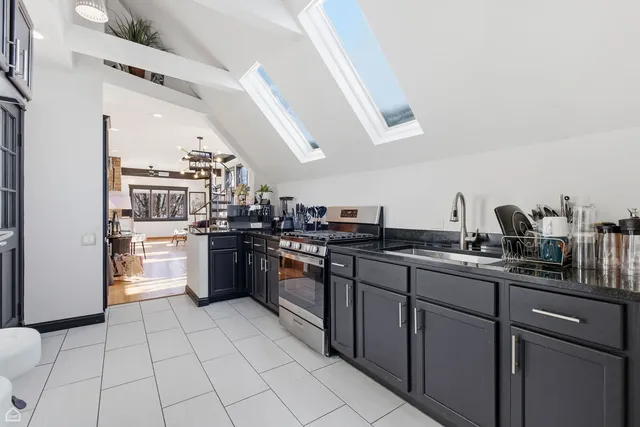 a view of a hallway with wooden floor and entryway