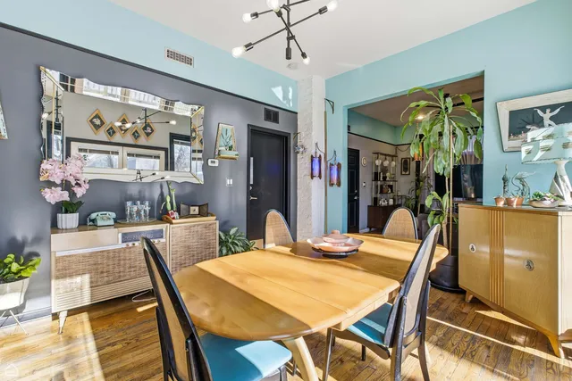a view of a house with a wooden fence