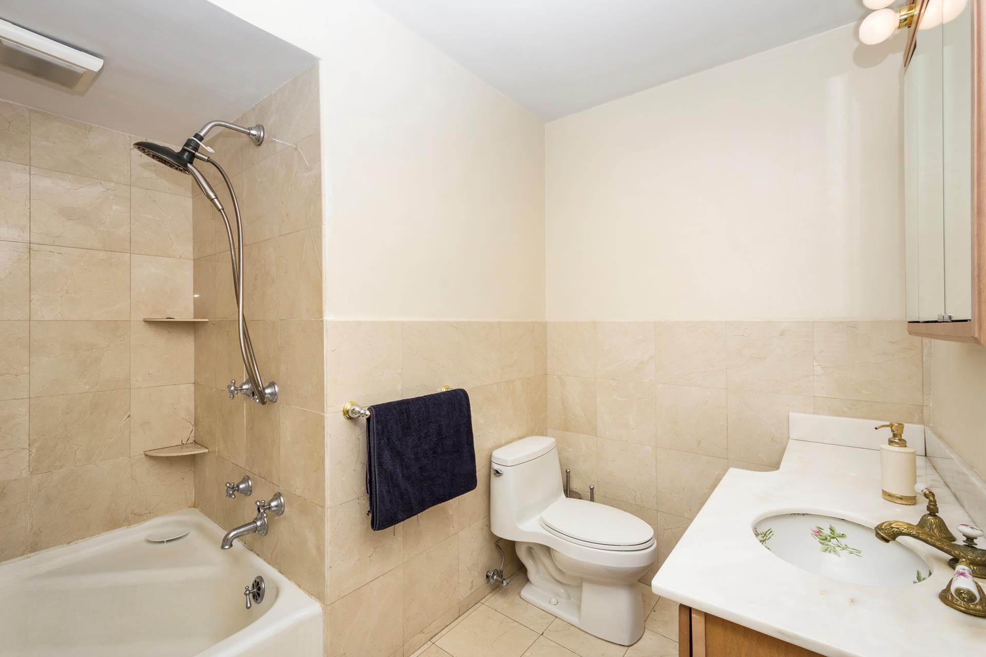 4600 Grosvenor Avenue Bronx, NY 10471 - Photo 12 of 13 a bathroom with a sink toilet and shower