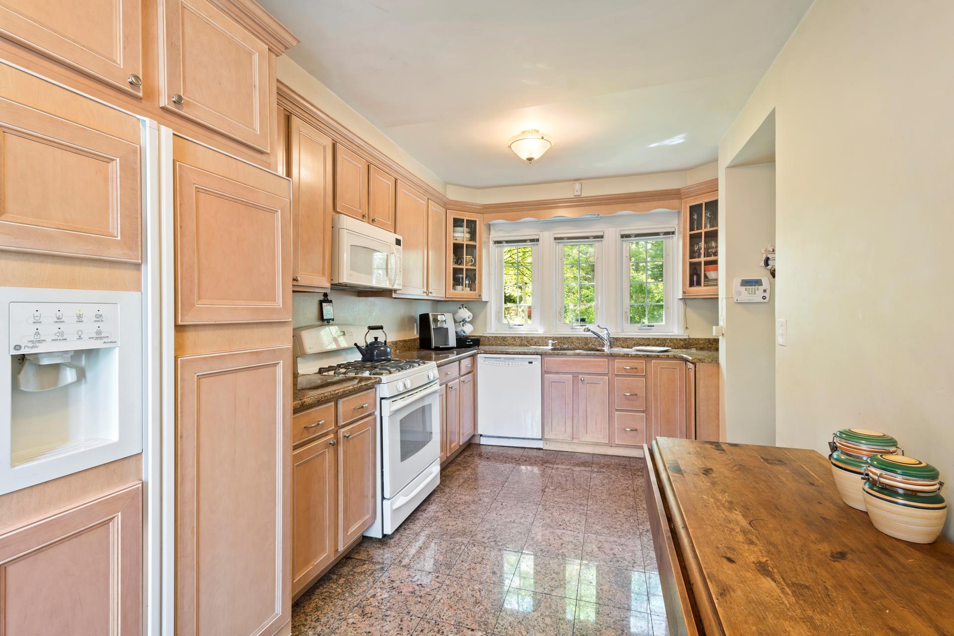 4600 Grosvenor Avenue Bronx, NY 10471 - Photo 5 of 13 a kitchen with stainless steel appliances granite countertop a stove a sink and a refrigerator
