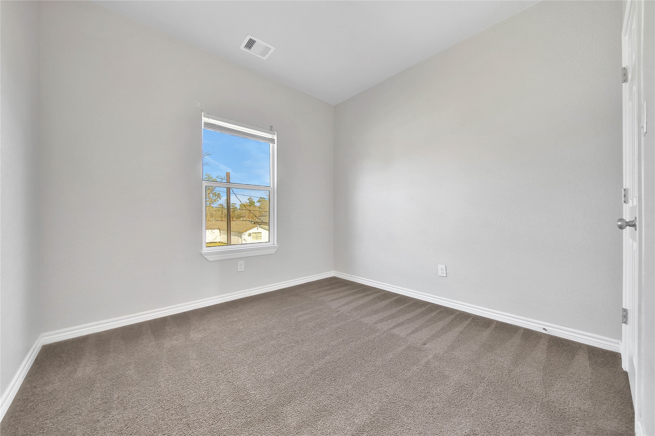 8034 Crestview Drive Houston, TX 77028 - Photo 12 of 15 a view of an empty room with a window