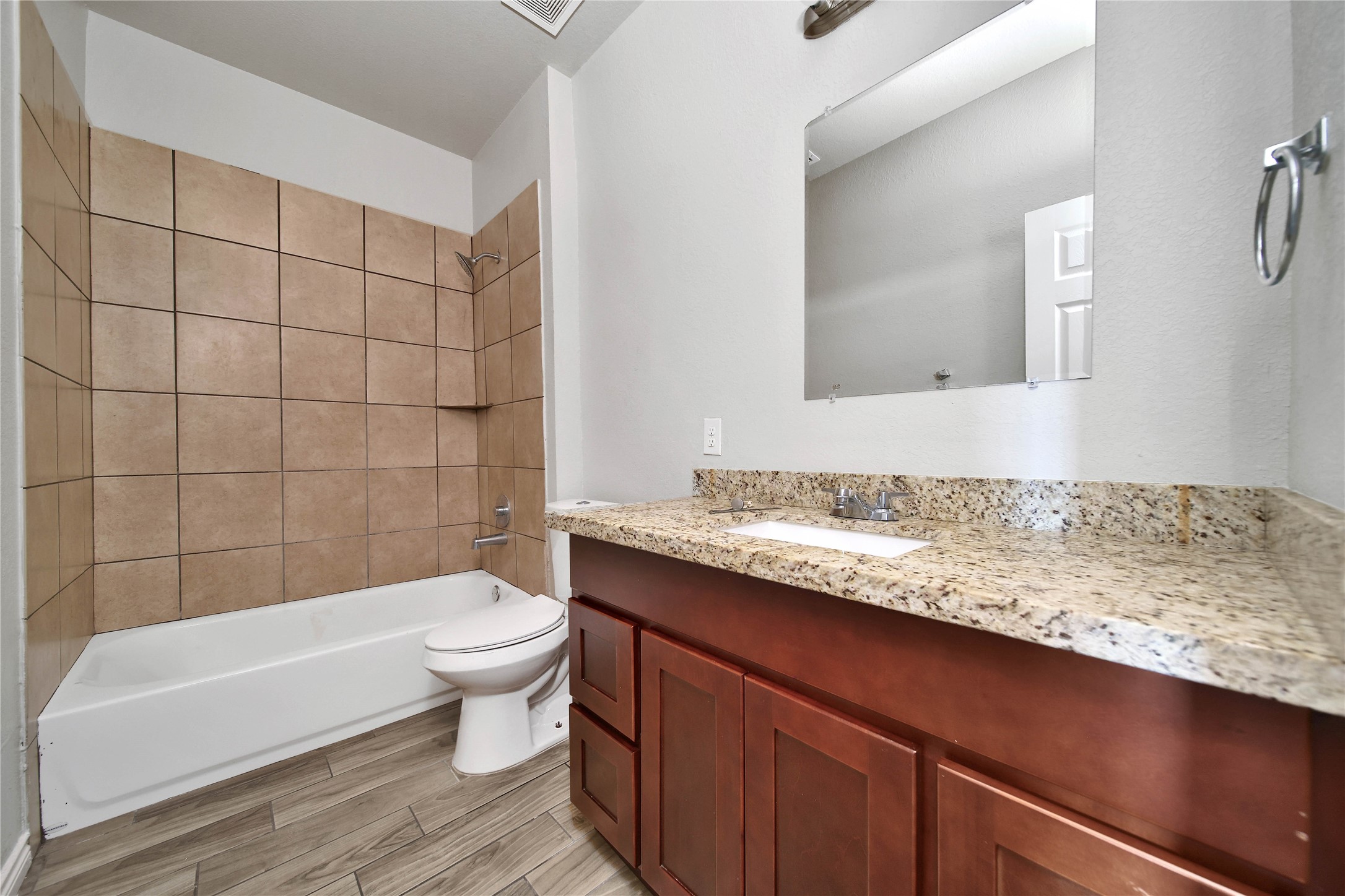 8034 Crestview Drive Houston, TX 77028 - Photo 13 of 15 a bathroom with a sink a toilet a mirror and bathtub