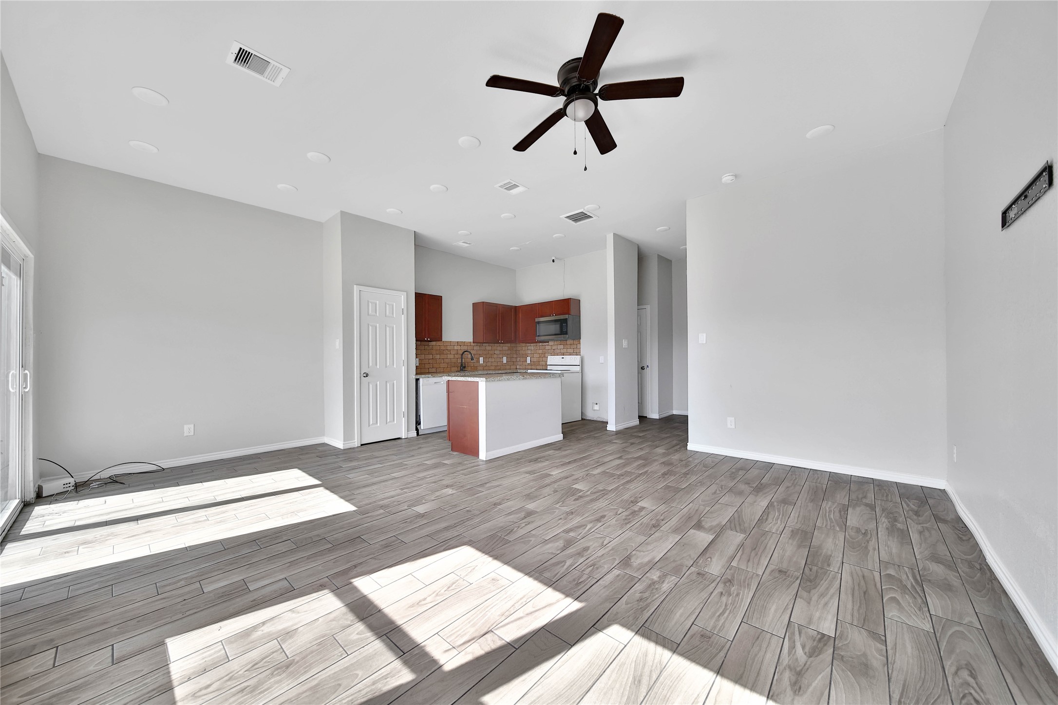 8034 Crestview Drive Houston, TX 77028 - Photo 3 of 15 a view of a kitchen with a dishwasher cabinets and wooden floor