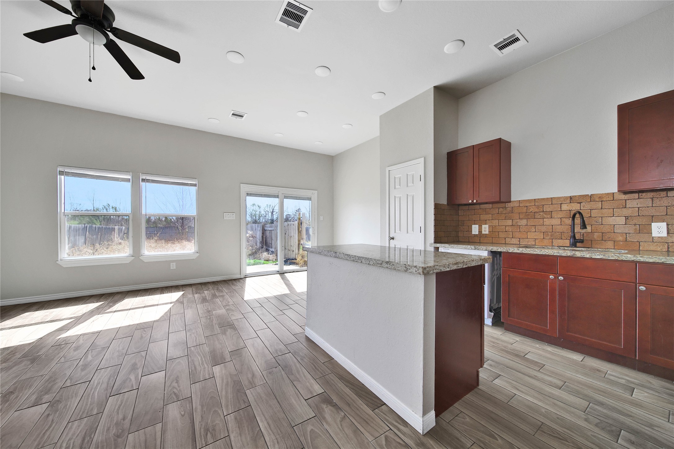 8034 Crestview Drive Houston, TX 77028 - Photo 4 of 15 a kitchen with granite countertop a stove a sink and a refrigerator