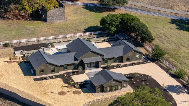 an aerial view of a house with outdoor space