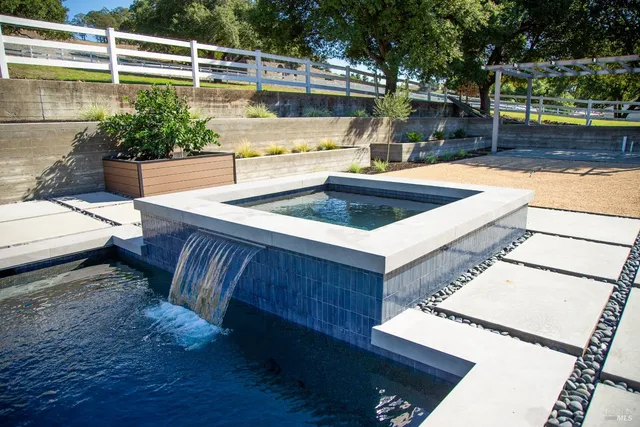a view of a patio with swimming pool