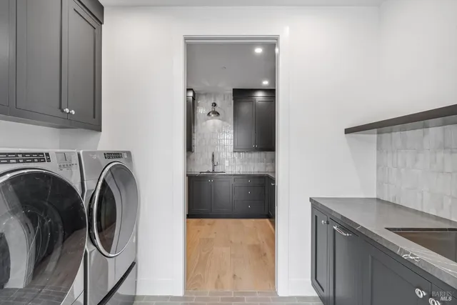 a view of bathroom with washer and dryer