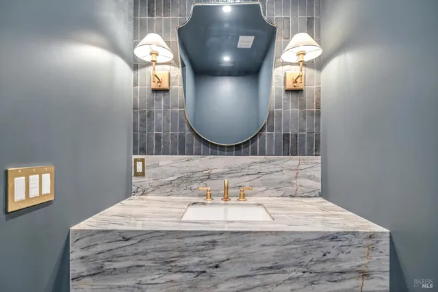 a bathroom with a sink and a mirror