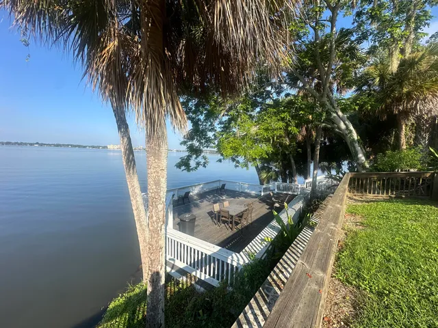 a balcony with couple of trees