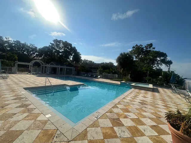 a view of swimming pool with a yard