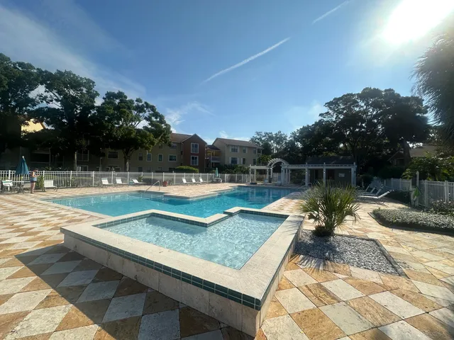 a view of a swimming pool with a patio